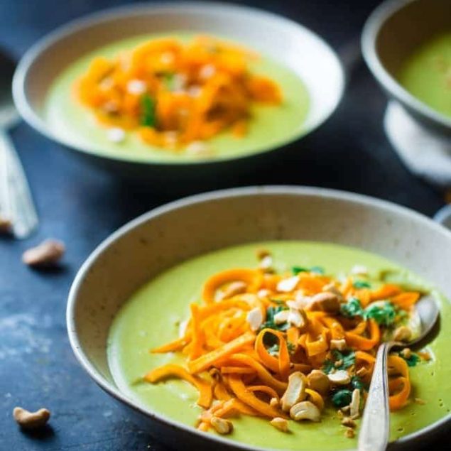 Vegan Cauliflower Coconut Curry Soup with Sweet Potato Noodles - This easy soup is made extra creamy with cauliflower and cashew cream! Top it with sweet potato noodles for a gluten free meal that is paleo friendly! | Foodfaithfitness.com | @FoodFaithFit