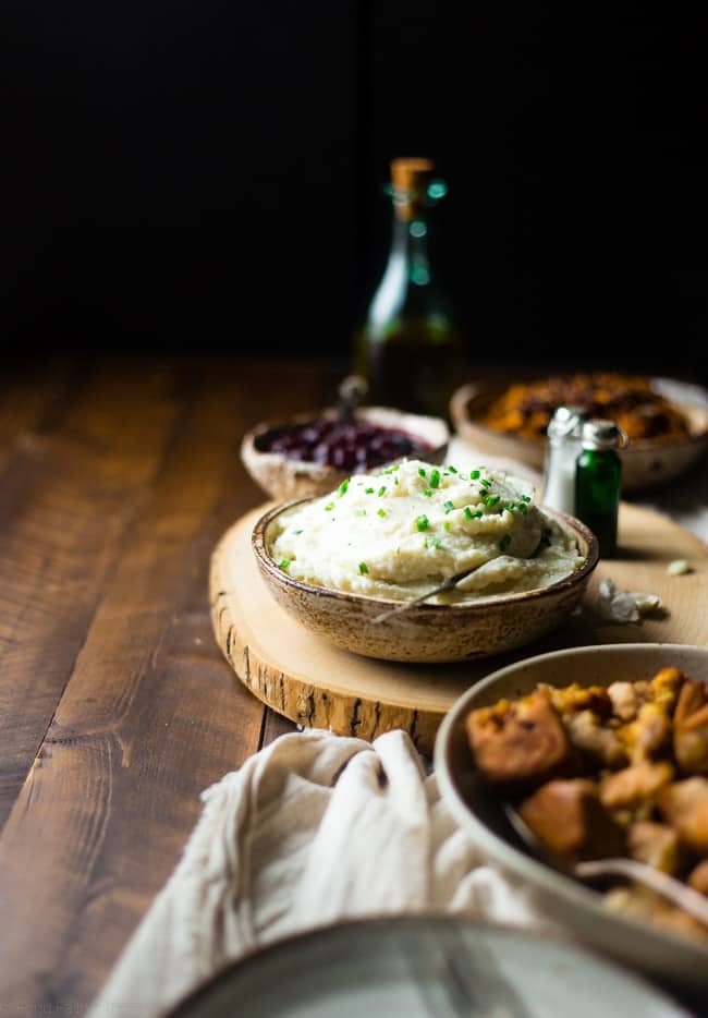 5 Ingredient Cauliflower Mashed Potatoes - These quick and easy, low carb cauliflower mashed potatoes only have 5 ingredients, 62 calories, 1 SmartPoint and use a secret ingredient to pack them with protein! Perfect for a healthy Thanksgiving! | Foodfaithfitness.com | @FoodFaithFit