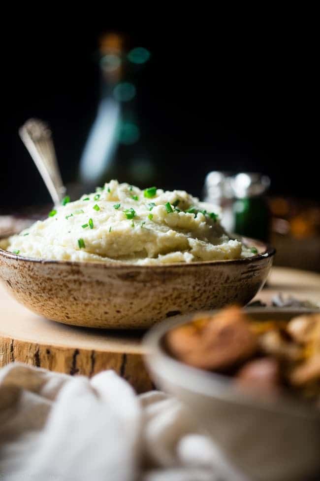 5 Ingredient Cauliflower Mashed Potatoes - These quick and easy, low carb and gluten free cauliflower mashed potatoes only have 5 ingredients, 62 calories, 1 SmartPoint and use a secret ingredient to pack them with protein! Perfect for a healthy Thanksgiving! | Foodfaithfitness.com | @FoodFaithFit