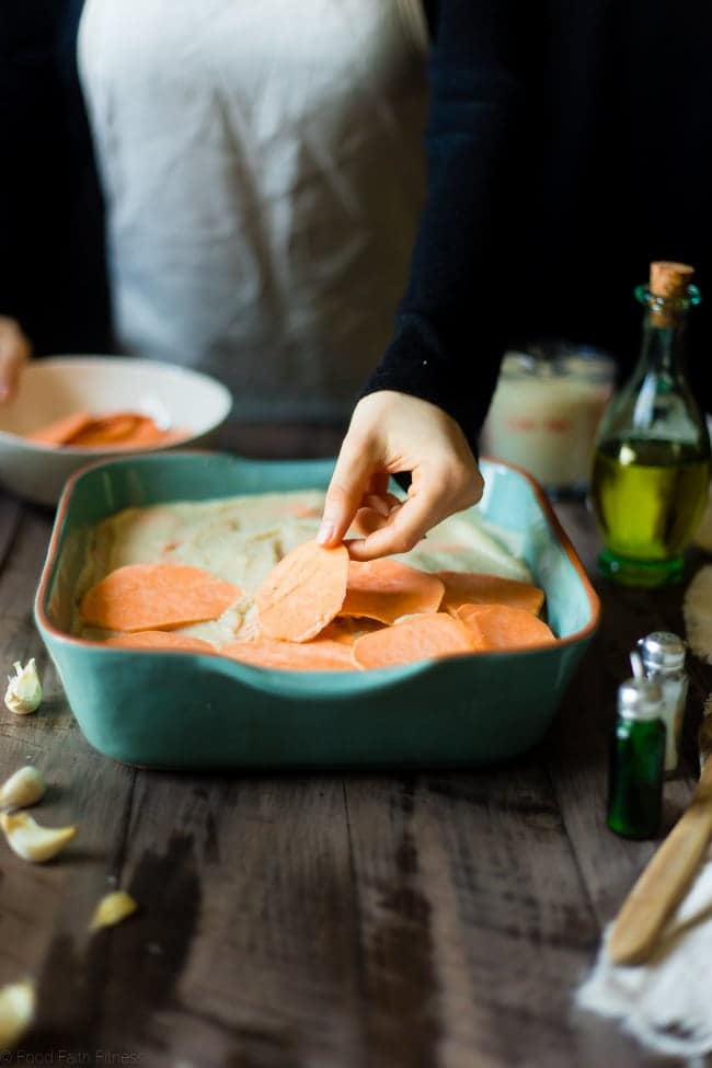 Cauliflower Alfredo Vegan Scalloped Sweet Potatoes - This whole30 compliant side dish is so creamy you'll never know they're under 200 calories, paleo friendly and have hidden veggies! Perfect for Thanksgiving! | Foodfaithfitness.com | @FoodFaithFit