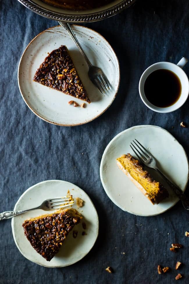 Three slices of easy pumpkin pecan cheesecake with a pecan topping, served with coffee.