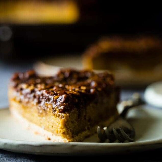 Easy pumpkin pecan cheesecake slice on a plate with a fork.