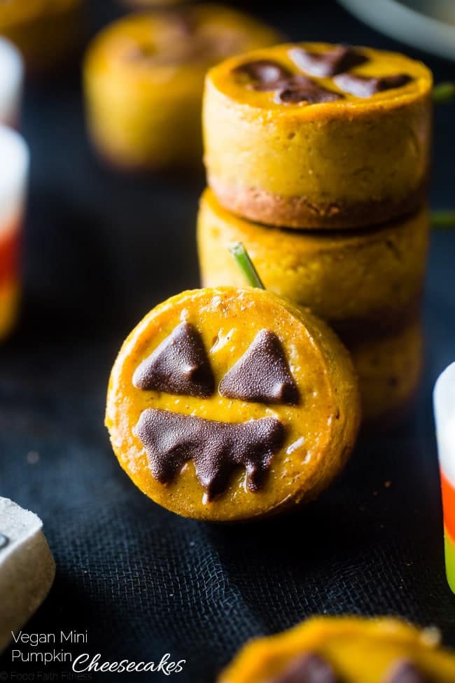Vegan Mini Pumpkin Jack-O-Lantern Cheesecakes - These pumpkin vegan cheesecakes are easy to make, and are perfect for Halloween! They're healthy, gluten free, paleo friendly and only 200 calories! | Foodfaithfitness.com | @FoodFaithFit