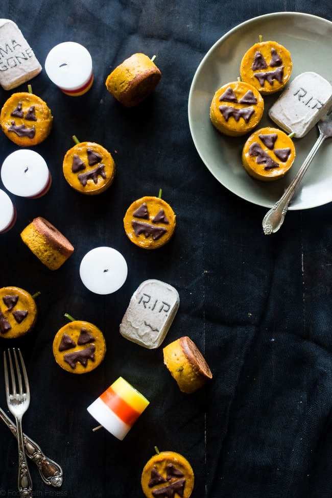 Vegan Mini Pumpkin Jack-O-Lantern Cheesecakes - These pumpkin vegan cheesecakes are easy to make, and are perfect for Halloween! They're healthy, gluten free, paleo friendly and only 200 calories! | Foodfaithfitness.com | @FoodFaithFit