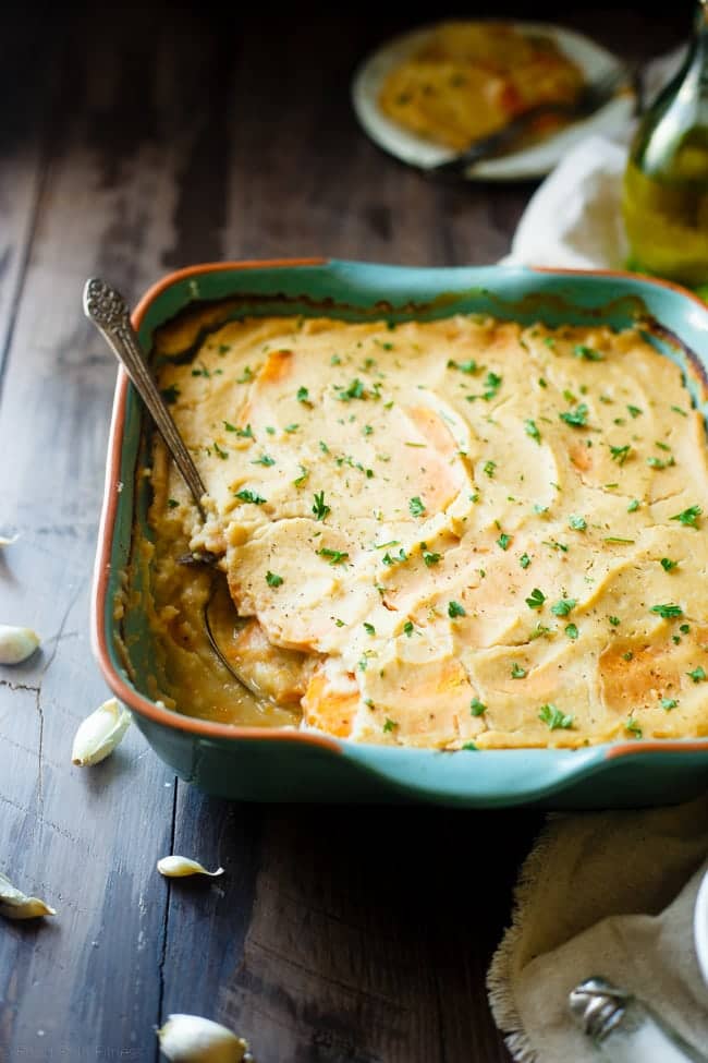 Cauliflower Alfredo Vegan Scalloped Sweet Potatoes - This whole30 compliant side dish is so creamy you'll never know they're under 200 calories, paleo friendly and have hidden veggies! Perfect for Thanksgiving! | Foodfaithfitness.com | @FoodFaithFit