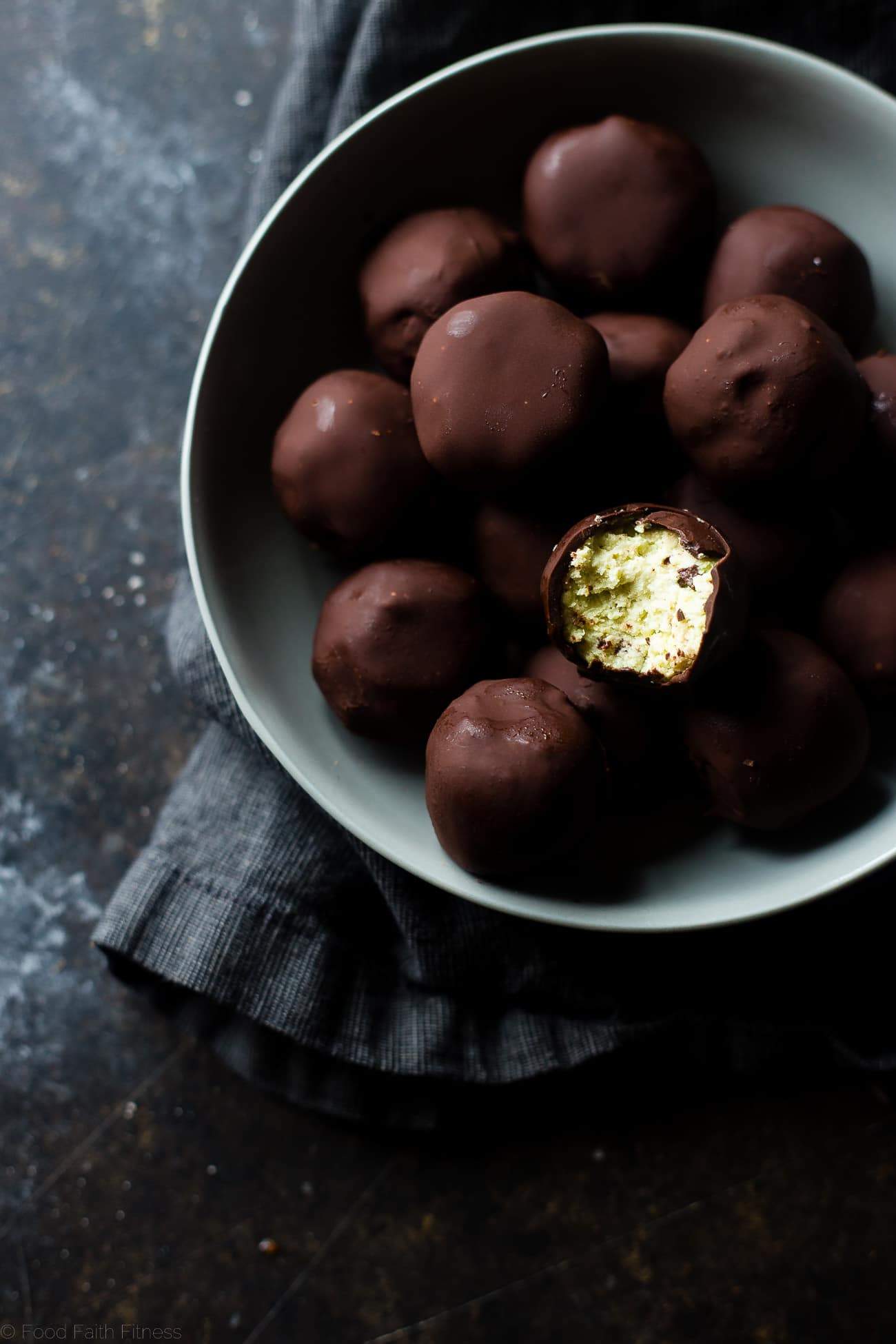 Mint Avocado Cheesecake Truffles - These low carb, protein-packed, creamy cheesecake truffles are covered in chocolate! They're a healthy, gluten free Christmas treat for only 90 calories! | Foodfaithfitness.com | @FoodFaithFit