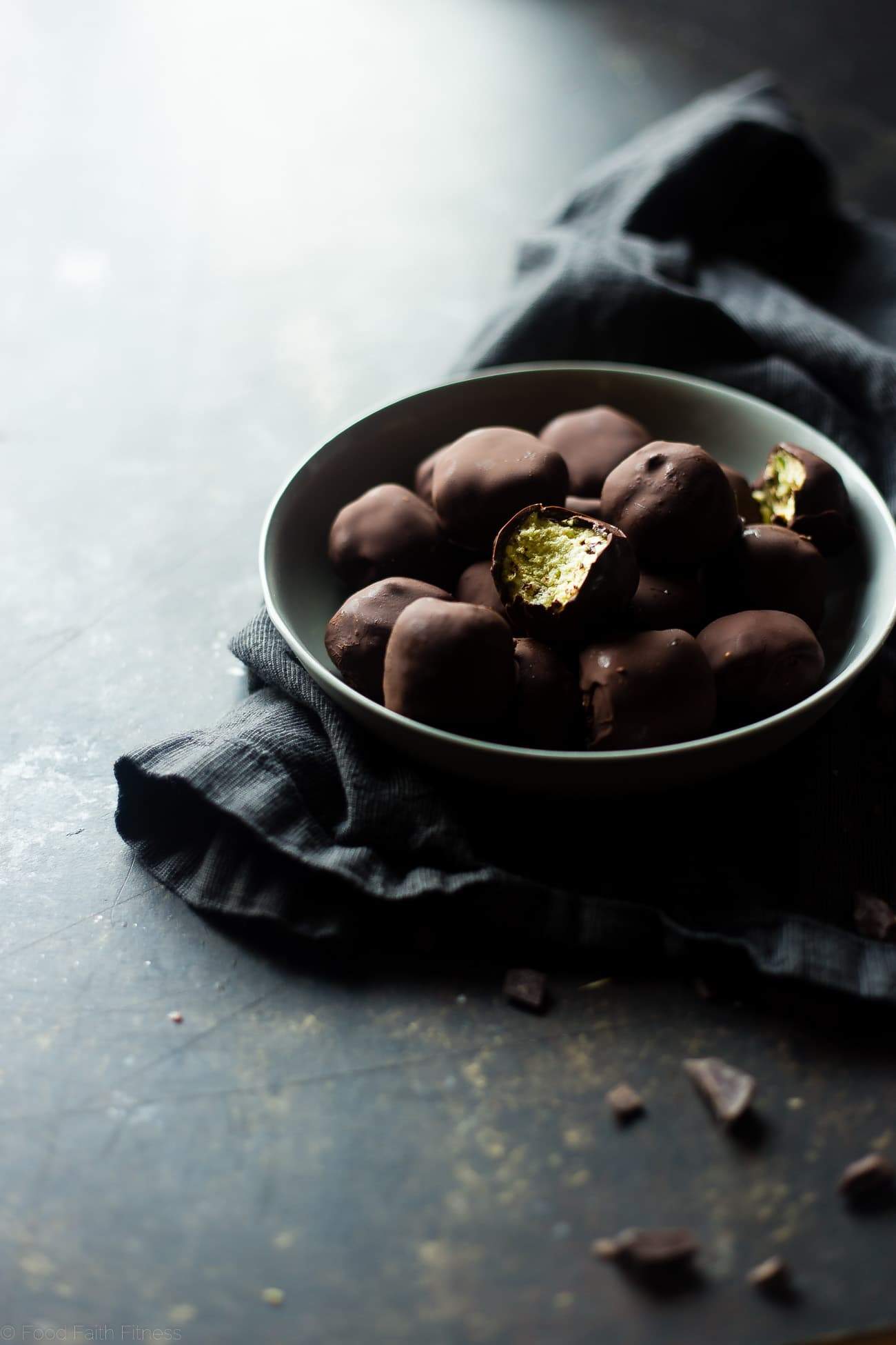 Mint Avocado Cheesecake Truffles - These low carb, protein-packed, creamy cheesecake truffles are covered in chocolate! They're a healthy, gluten free Christmas treat for only 90 calories! | Foodfaithfitness.com | @FoodFaithFit
