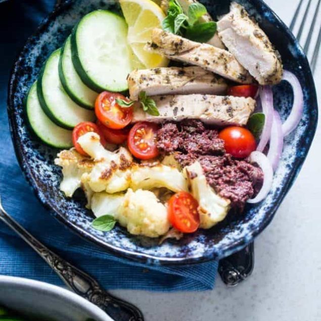 Greek Chicken Meal Prep Bowls - These low carb chicken bowls have roasted cauliflower and an olive tapenade. They're an easy, whole30 compliant, paleo meal that you can prep ahead, and their only 300 calories! | Foodfaithfitness.com | @FoodFaithFit