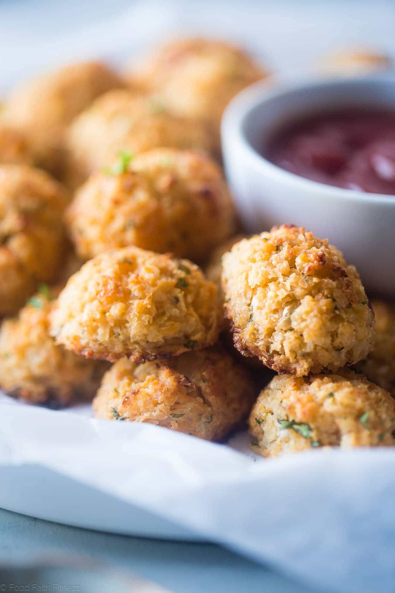 Baked Cauliflower Tater Tots - A gluten free, lower carb version of the classic comfort food that are crispy on the outside and soft on the inside. You'll never know they're healthy and made from hidden veggies! | Foodfaithfitness.com | @FoodFaithFit