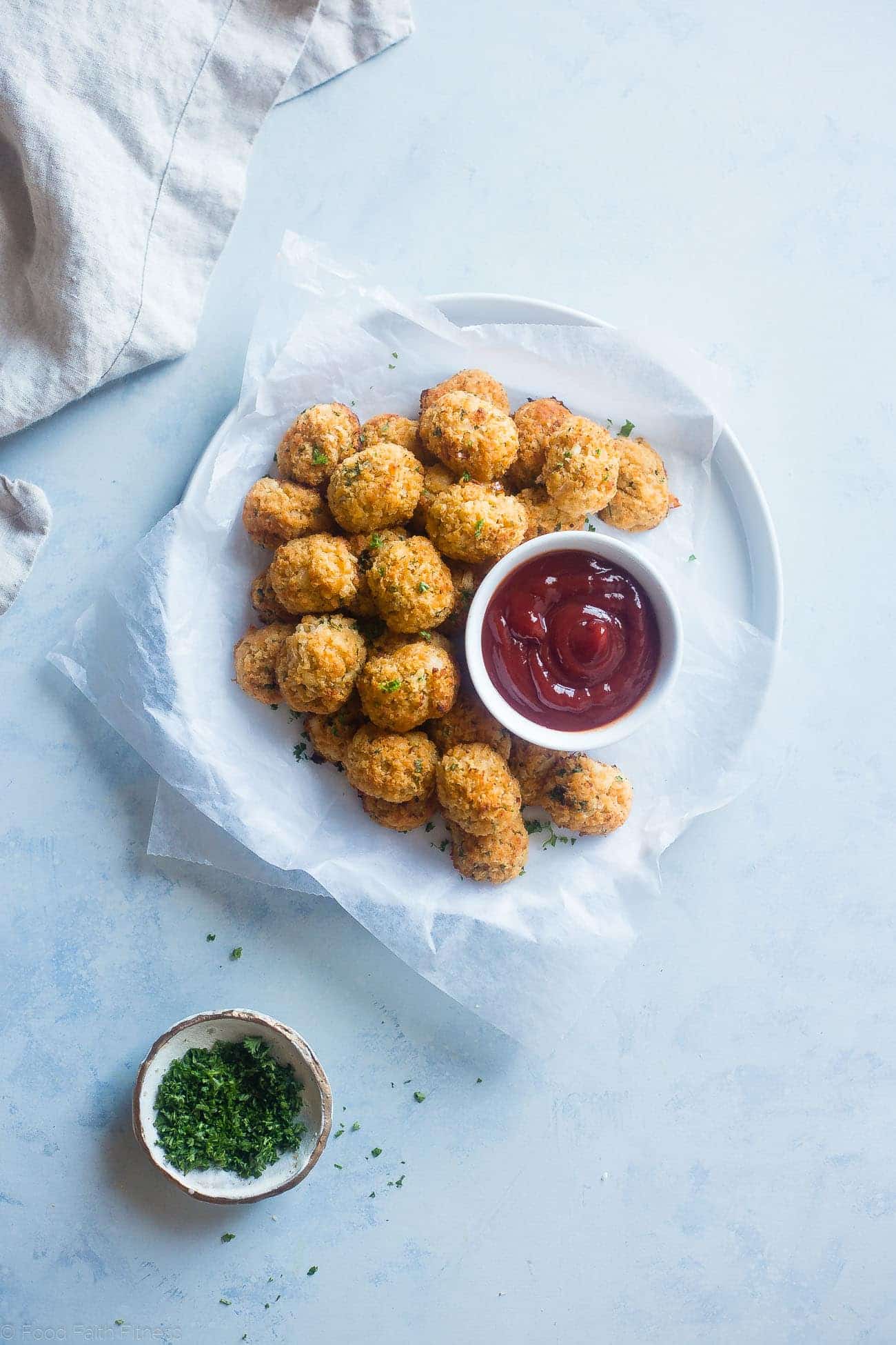 Baked Cauliflower Tater Tots - A gluten free, lower carb version of the classic comfort food that are crispy on the outside and soft on the inside. You'll never know they're healthy and made from hidden veggies! | Foodfaithfitness.com | @FoodFaithFit