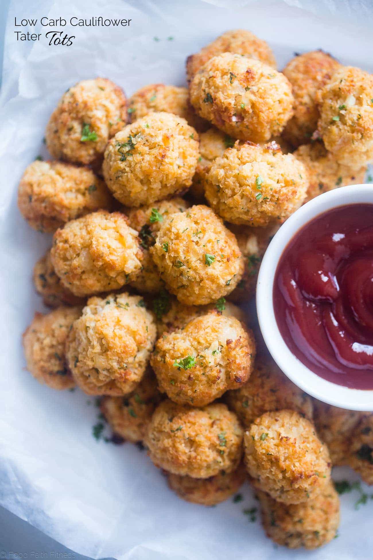 Baked Cauliflower Tater Tots - A gluten free, lower carb version of the classic comfort food that are crispy on the outside and soft on the inside. You'll never know they're healthy and made from hidden veggies! | Foodfaithfitness.com | @FoodFaithFit