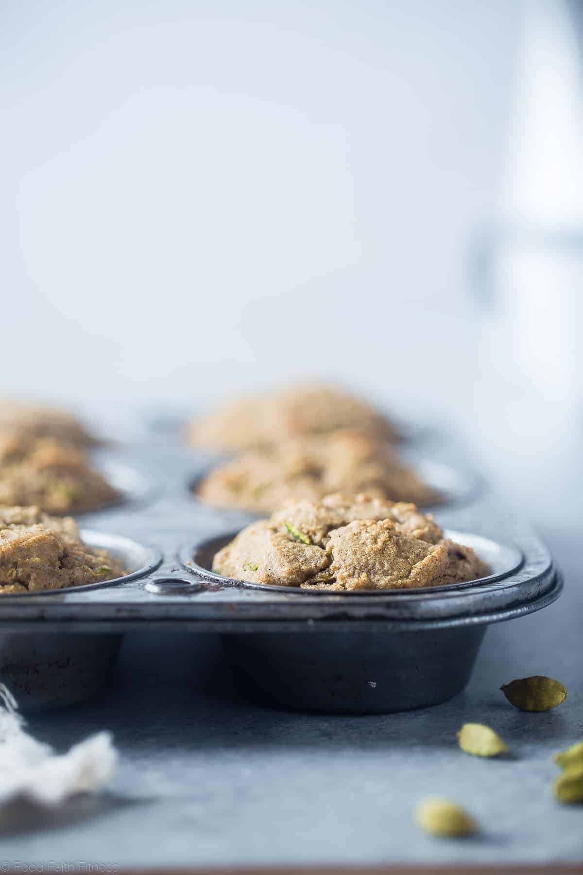 Low Carb Keto Zucchini Tahini Muffins - These low carb muffins use zucchini and tahini to make them so moist and fluffy! They're a healthy, dairy, gluten and sugar free breakfast or snack for spring! | #Foodfaithfitness | #glutenfree #lowcarb #keto #healthy #sugarfree keto zucchini muffins in baking tin on a table