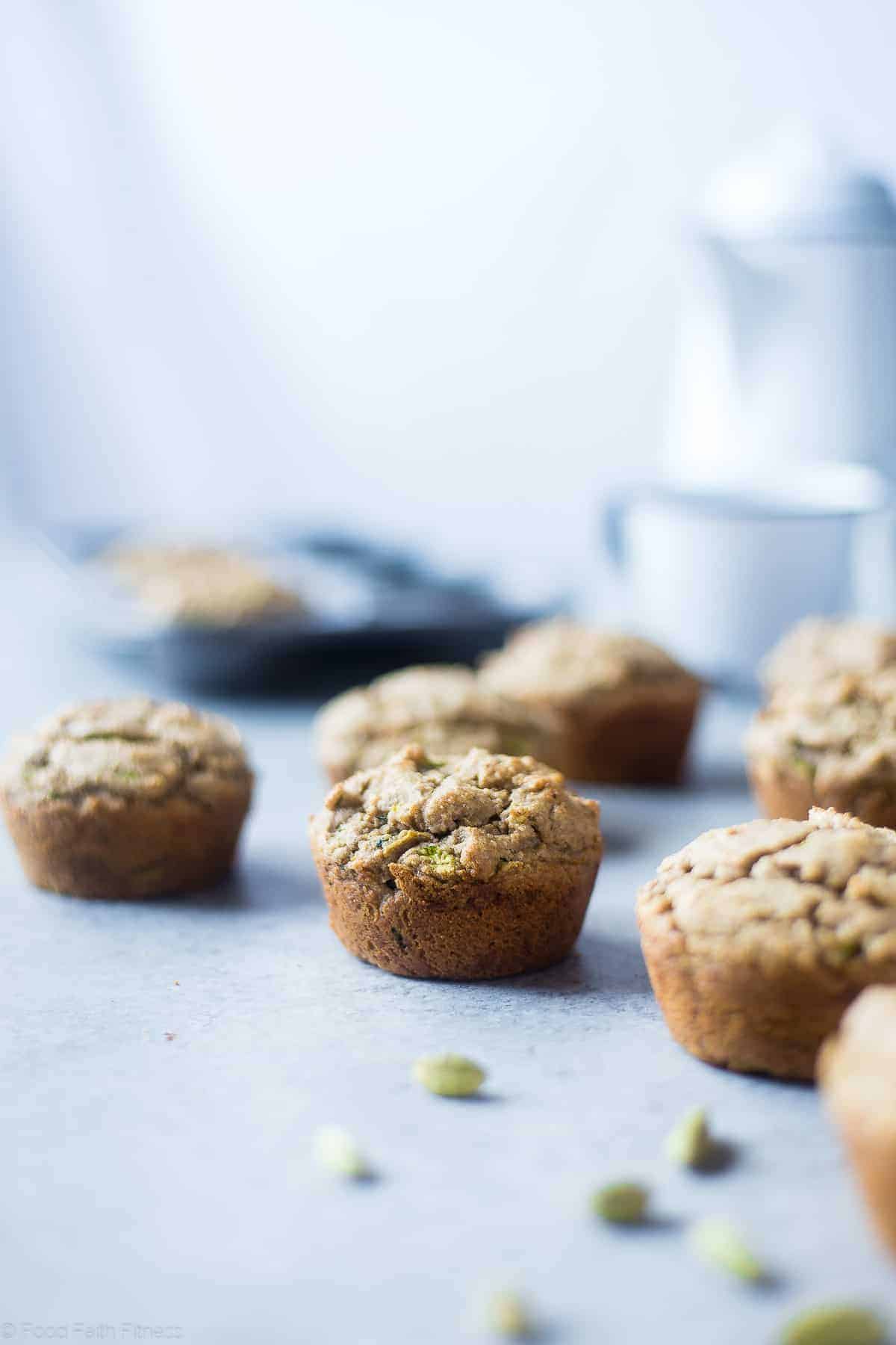 Low Carb Keto Zucchini Tahini Muffins - These low carb muffins use zucchini and tahini to make them so moist and fluffy! They're a healthy, dairy, gluten and sugar free breakfast or snack for spring! | #Foodfaithfitness | #glutenfree #lowcarb #keto #healthy #sugarfree side view of keto zucchini muffins on a table