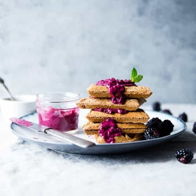 Single Serve Vegan Protein Waffles - These gluten free waffles are ready in only 10 minutes and are packed with healthy, plant-based protein! Top them with blackberry sauce for a delicious breakfast! | Foodfaithfitness.com | @FoodFaithFit
