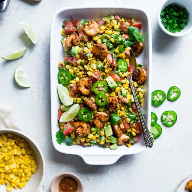 Healthy Honey Lime Grilled Mexican Corn Salad with Shrimp - This quick and easy, gluten free salad is tossed with juicy, smoky shrimp and has a sweet and tangy honey lime vinaigrette! Perfect for summer cook outs! | Foodfaithfitness.com | @FoodFaithFit