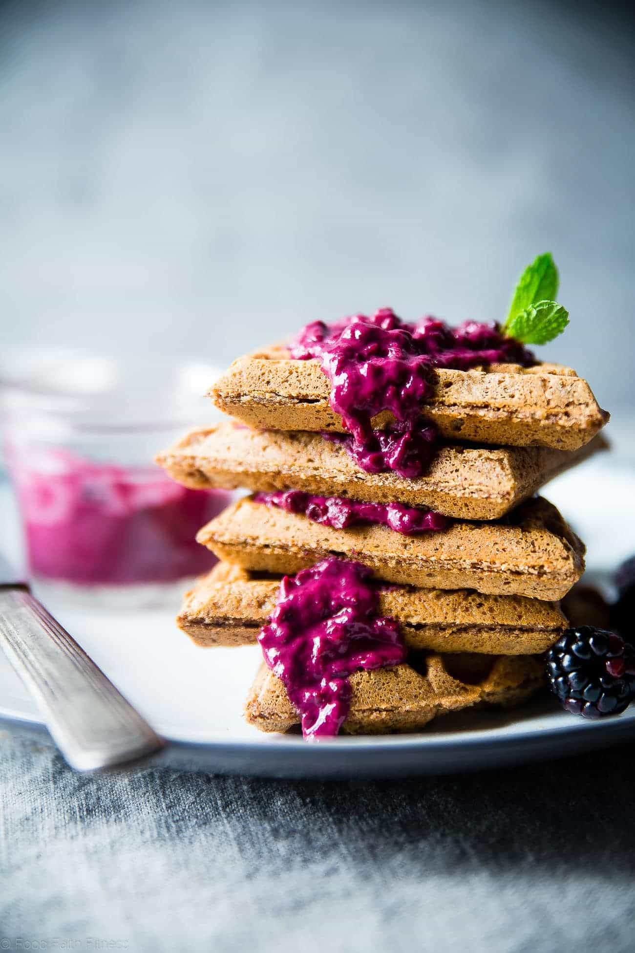 Single Serve Vegan Protein Waffles - These gluten free waffles are ready in only 10 minutes and are packed with healthy, plant-based protein! Top them with blackberry sauce for a delicious breakfast! | Foodfaithfitness.com | @FoodFaithFit