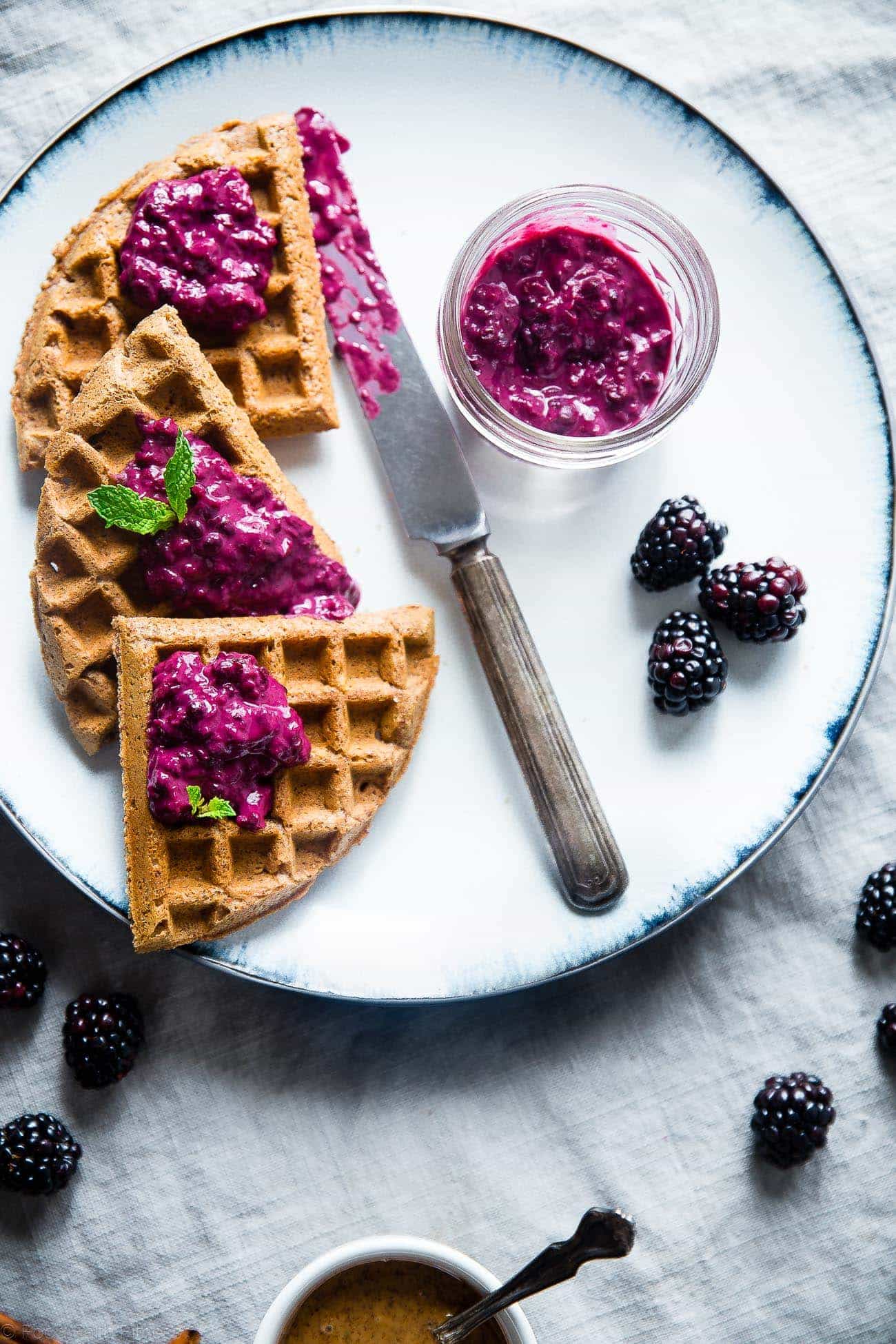 Single Serve Vegan Protein Waffles - These gluten free waffles are ready in only 10 minutes and are packed with healthy, plant-based protein! Top them with blackberry sauce for a delicious breakfast! | Foodfaithfitness.com | @FoodFaithFit
