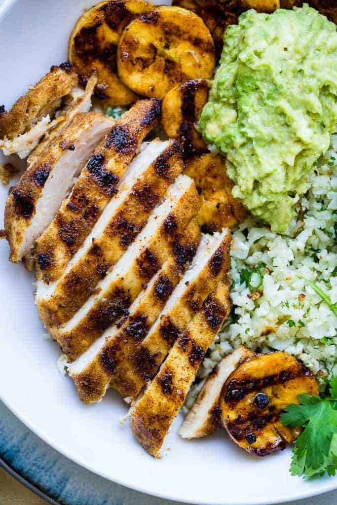 tight, close-up photo of Caribbean Chicken Bowls. Recipe on Foodfaithfitness.com