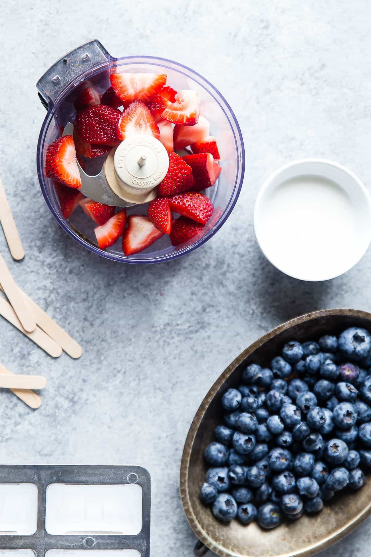 Vegan Red, White and Blue Popsicles - These healthy and dairy free coconut popsicles are a gluten free, patriotic summer treat that are only 4 ingredients and 110 calories! Perfect for July 4th! | Foodfaithfitness.com | @FoodFaithFit