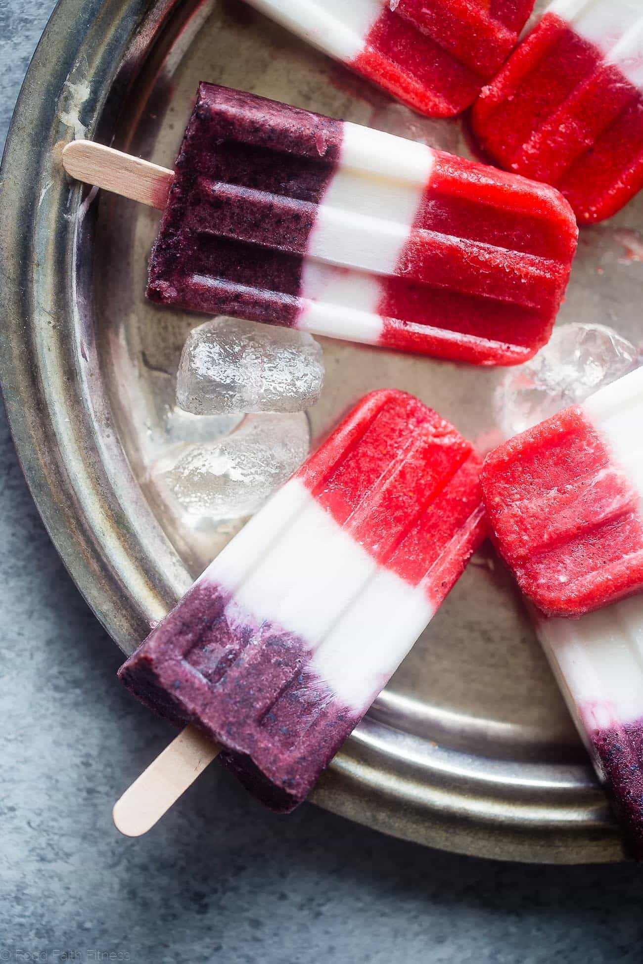 Vegan Red, White and Blue Popsicles - These healthy and dairy free coconut popsicles are a gluten free, patriotic summer treat that are only 4 ingredients and 110 calories! Perfect for July 4th! | Foodfaithfitness.com | @FoodFaithFit