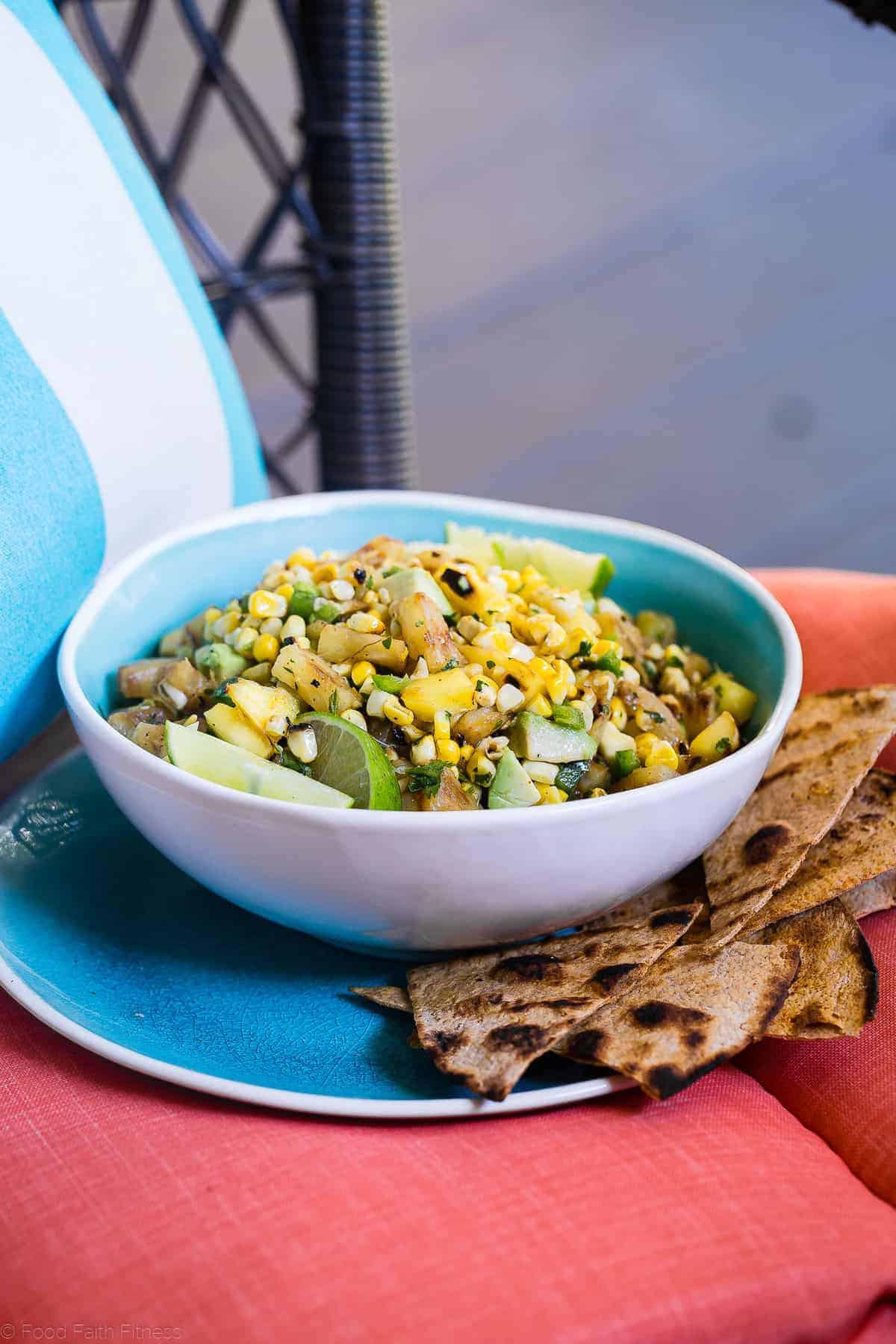 Tropical Grilled Corn Salsa - This quick and easy grilled pineapple mango salsa is mixed with corn and a honey lime vinaigrette for an a healthy, gluten free and vegan-friendly summer appetizer or dinner! | #Foodfaithfitness | #glutenfree #salsa #corn #healthy side view of pineapple mango salsa with chips on a plate and bowl