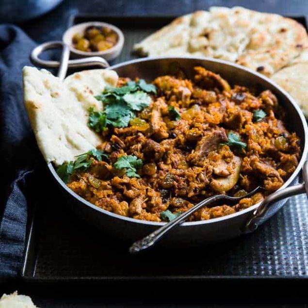Indian Chicken Rice Casserole - This dairy and gluten free casserole is made in one pot and has delicious Indian curry flavors! It's a quick and easy, healthy weeknight meal that freezes well and makes great leftovers! | Foodfaithfitness.com | @FoodFaithFit