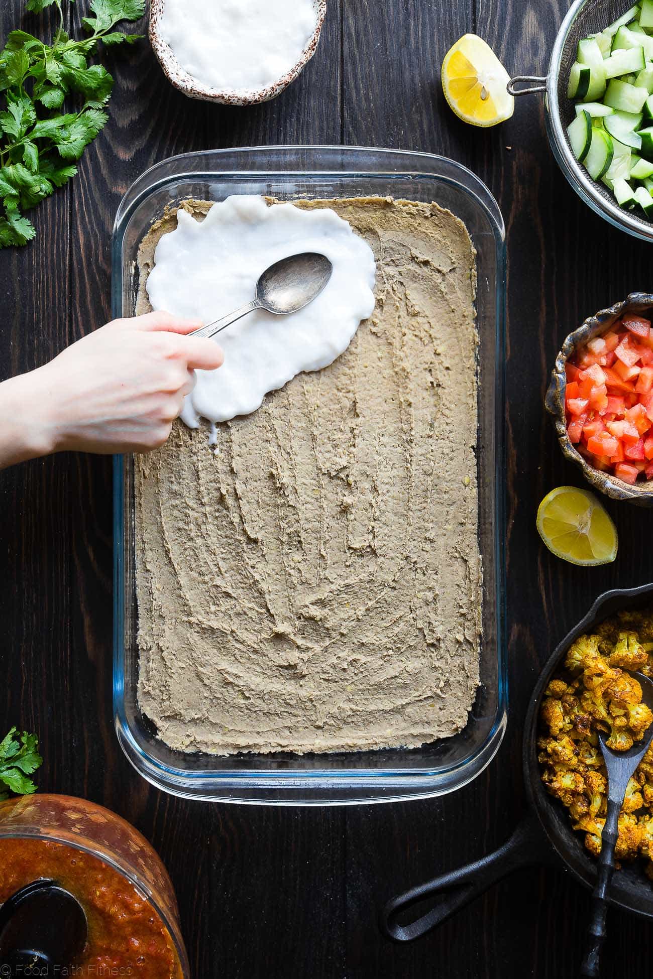 Healthy Indian 7 Layer Dip - The classic 7 layer dip recipe gets a healthy, Indian makeover! This dip is loaded with spicy, ethnic flavors and is gluten free and vegan friendly too! It's only 170 calories and perfect for game day! | Foodfaithfitness.com | @FoodFaithFit
