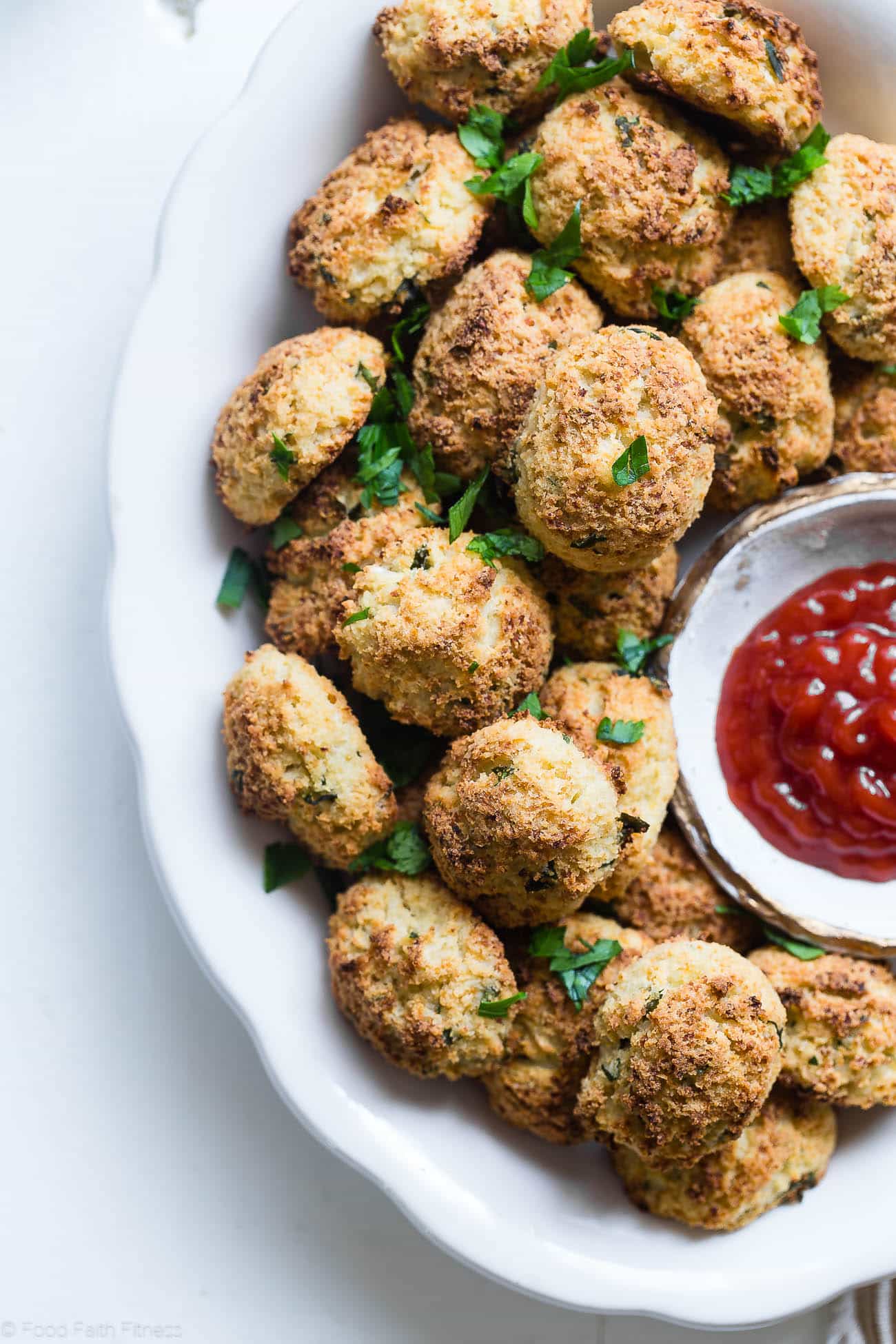 Paleo Cauliflower Tater Tots - So crispy and crunchy you will never believe they're gluten/grain/dairy free, low carb and made from veggies! Even your kids will love them! | Foodfaithfitness.com | @FoodFaithFit