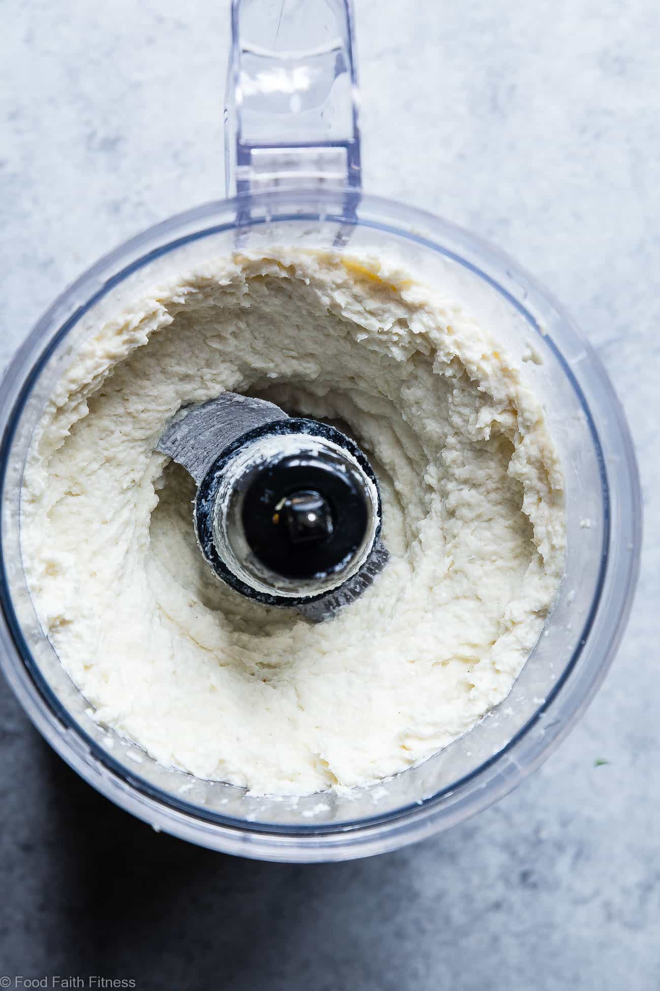 Healthy Garlic Mashed Cauliflower Potatoes - This 4 ingredient cauliflower mash is a vegan, gluten free and low carb side dish! They're only 70 calories, 2 Smartpoints and are a great way to get kids to eat veggies! Perfect for Thanksgiving! | Foodfaithfitness.com | @FoodFaithFit