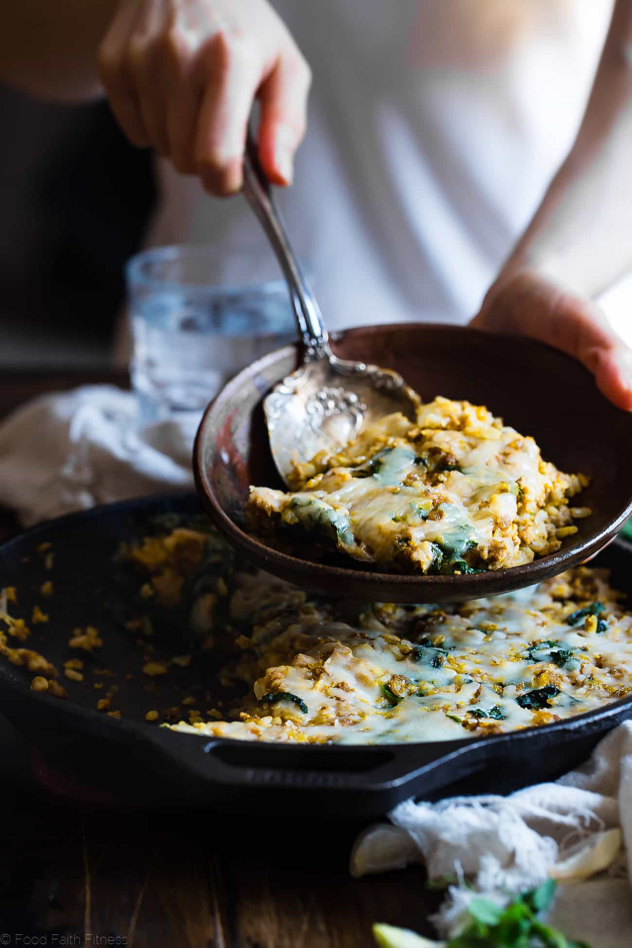 One Pot Pumpkin Rice Casserole - This rice casserole only requires one pot, under 10 ingredients and has lots of cheesy, pumpkin taste! It's an easy, gluten free, healthy fall dinner that is sure to be a crowd pleaser! | Foodfaithfitness.com | @FoodFaithFit