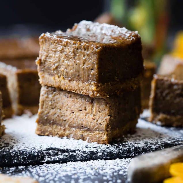 Dairy Free Vegan Coffee Gingerbread Cheesecake Bars - These little bites of gingerbread bliss are SO creamy and spicy-sweet! A paleo friendly, healthy and gluten free dessert for the holidays that you will never believe is dairy and egg free!  | Foodfaithfitness.com | @FoodFaithFit