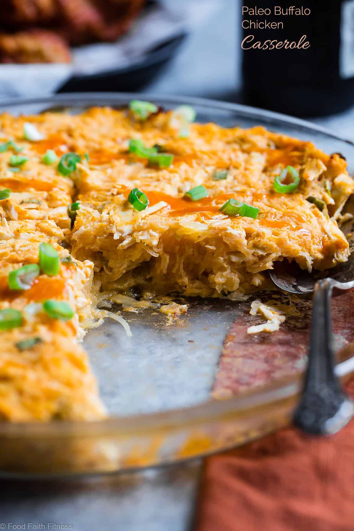 paleo buffalo chicken spaghetti squash casserole on a table with a spoon