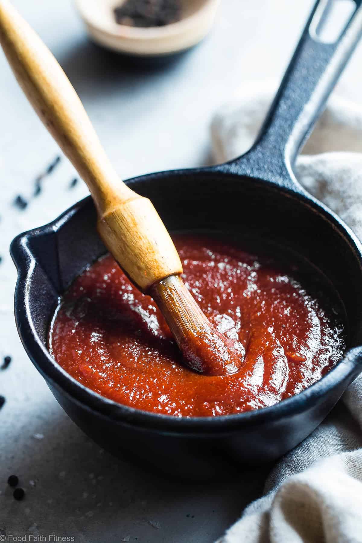Sugar Free Low Carb BBQ Sauce - A simple, healthy homemade, sugar free BBQ sauce that is going to be your go-to this summer since it's good on so many things and so easy to make! Only 20 calories and 1 Freestyle point per serving! | #Foodfaithfitness | #Glutenfree #Lowcarb #Sugarfree #BBQSauce #Grilling close up of sugar free bbq sauce in a small iron pan