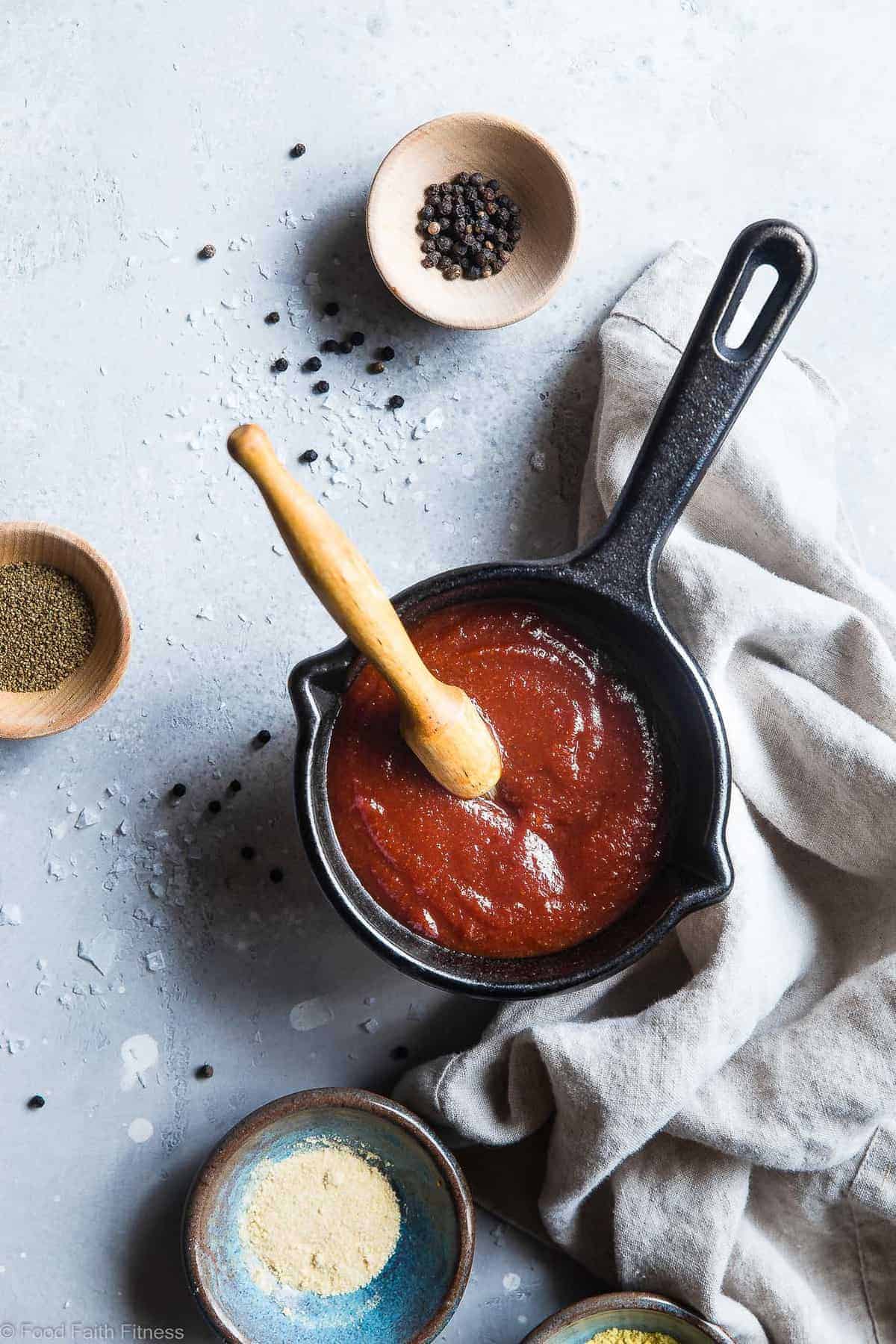 Sugar Free Low Carb BBQ Sauce - A simple, healthy homemade, sugar free BBQ sauce that is going to be your go-to this summer since it's good on so many things and so easy to make! Only 20 calories and 1 Freestyle point per serving! | #Foodfaithfitness | #Glutenfree #Lowcarb #Sugarfree #BBQSauce #Grilling Sugar Free BBQ Sauce over view in a small pan with sauce brush