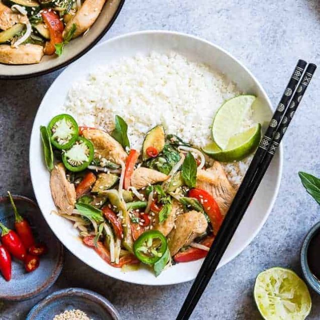 Spicy Thai Basil Chicken Stir Fry - A 20 minute, healthy, gluten free dinner that is paleo friendly, lower carb and only 300 calories! It will be your new go to weeknight meal! | #Foodfaithfitness | #Glutenfree #Paleo #Lowcarb #Healthy #DairyFree