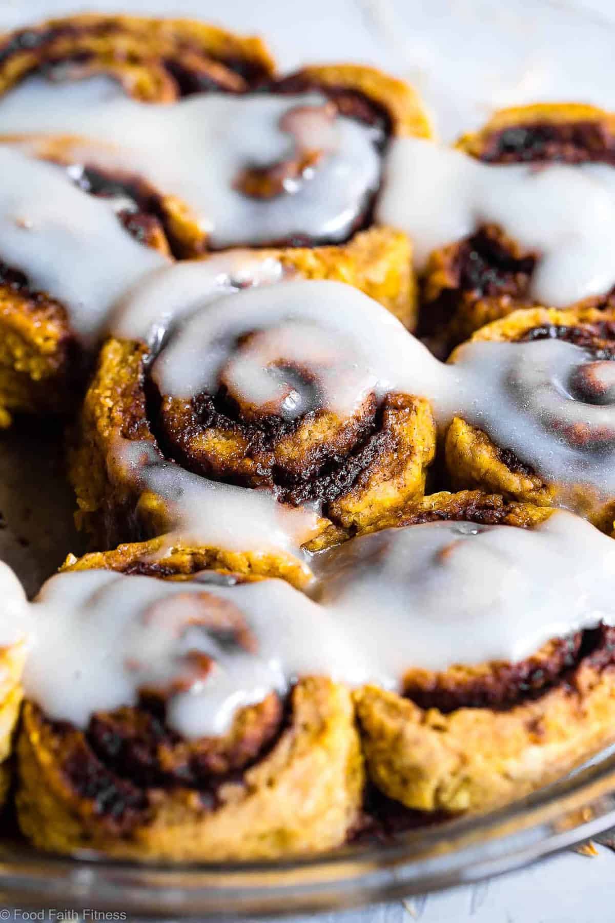 Gluten Free Vegan Pumpkin Cinnamon Rolls - These easy Pumpkin Spice Cinnamon Rolls are so soft and fluffy you won't believe they're gluten, dairy and egg free! Loaded with spicy-sweet fall flavor and SO delicious! | #Foodfaithfitness | #Glutenfree #vegan #dairyfree #eggfree #pumpkin