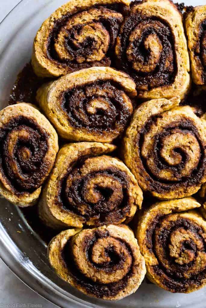 Gluten Free Pumpkin Vegan Cinnamon Roll Recipe - These easy Pumpkin Spice Cinnamon Rolls are so soft and fluffy you won't believe they're gluten, dairy and egg free! Loaded with spicy-sweet fall flavor and SO delicious! | #Foodfaithfitness | #Glutenfree #vegan #dairyfree #eggfree #pumpkin