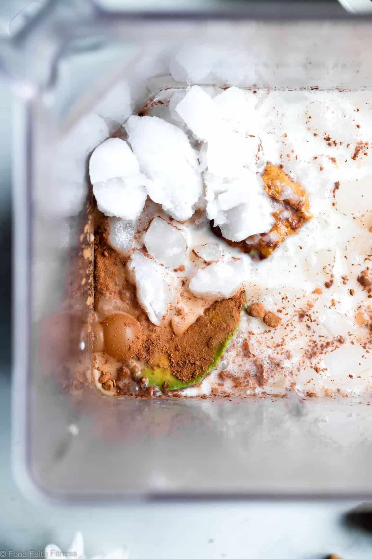 Peanut Butter Chocolate Keto Low Carb Smoothie - An EASY 5 ingredient breakfast that tastes like a peanut butter cup! It's Gluten/dairy/sugar free, paleo friendly, SO creamy and packed with plant based protein too! | #Foodfaithfitness | #Glutenfree #paleo #keto #lowcarb #sugarfree keto smoothie ingredients being blended in a blender
