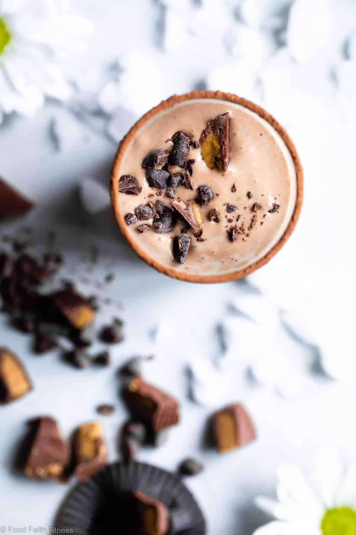 Peanut Butter Chocolate Keto Low Carb Smoothie - An EASY 5 ingredient breakfast that tastes like a peanut butter cup! It's Gluten/dairy/sugar free, paleo friendly, SO creamy and packed with plant based protein too! | #Foodfaithfitness | #Glutenfree #paleo #keto #lowcarb #sugarfree top view of a Keto Smoothie in a tall glass