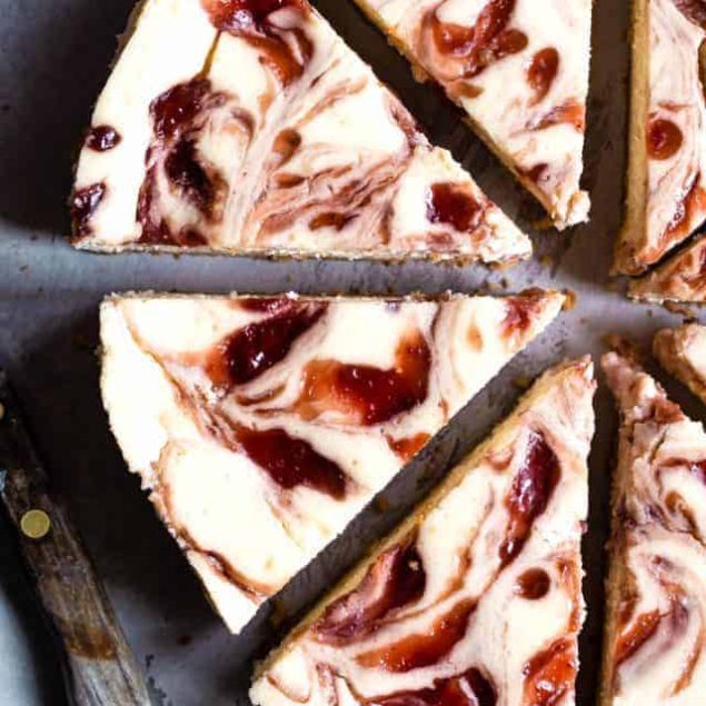 Gluten Free Strawberry Swirled Cottage Cheese Cheesecake - This Healthy Cottage Cheese Cheesecake is packed with protein and is so easy to make! Gluten free, grain free, better for you and SO creamy! | #Foodfaithfitness | #Glutenfree #Grainfree #Healthy #Cheesecake #Cottagecheese