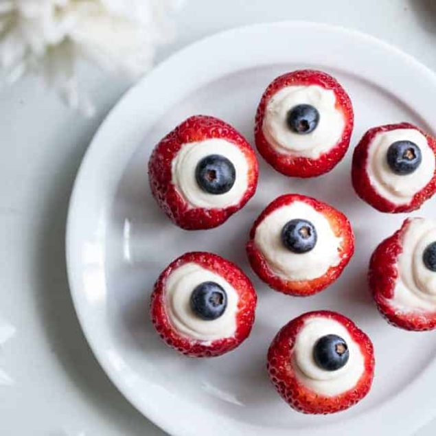 Red White & Blue Cheesecake Stuffed Strawberries - A gluten free, low carb, keto and sugar free dessert that are SO easy to make! Only 30 calories and so tasty! Perfect for the Summer or July 4th! | #Foodfaithfitness | #Glutenfree #Lowcarb #Keto #Sugarfree #July4th