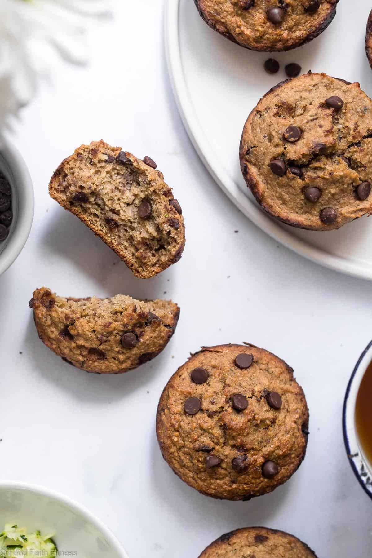 Healthy Zucchini Bread Muffins - These dairy free Zucchini Muffins are fluffy and gluten, dairy, oil and sugar free! Sweetened with dates, studded with chocolate chips and only 170 calories! Great for kids and adults! | #Foodfaithfitness | Healthy Gluten Free Zucchini Muffins - These dairy free Zucchini Muffins are fluffy and gluten, dairy, oil and sugar free! Sweetened with dates, studded with chocolate chips and only 170 calories! Great for kids and adults! | #Foodfaithfitness | #Glutenfree #Dairyfree #Healthy #Zucchini #sugarfree