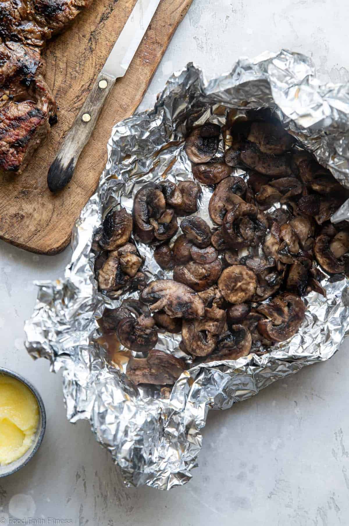 Keto Steak with Garlic Butter Mushrooms - This keto steak recipe is topped with garlic butter mushrooms and grilled to perfection! A low carb, paleo and whole30 healthy Summer dinner! | #Foodfaithfitness | #Glutenfree #Paleo #Keto #Lowcarb #whole30 Grilled mushrooms in a tinfoil packet