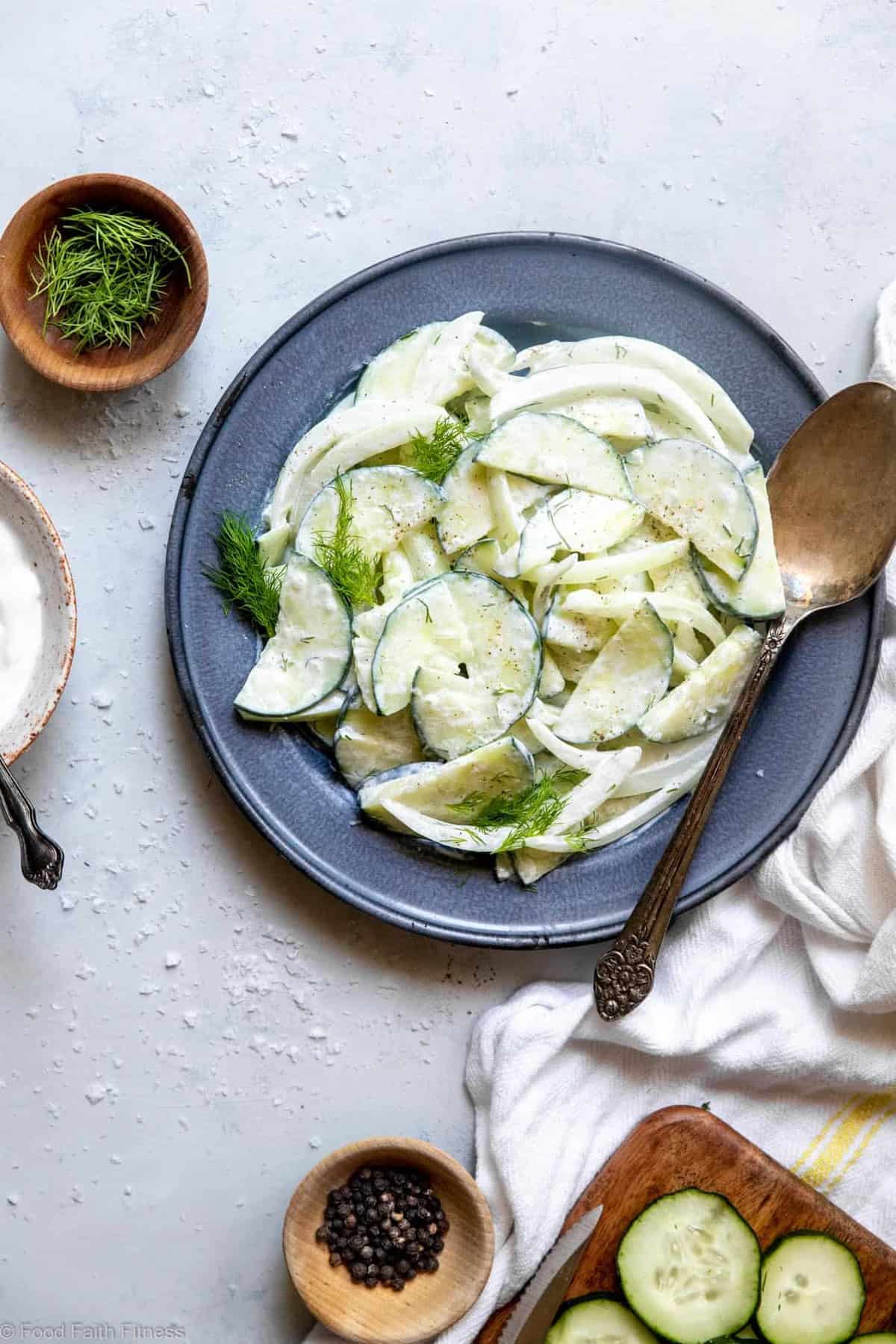 Low Carb Keto Cucumber Salad - An easy summer side that uses only 6 pantry essential ingredients! Creamy, naturally gluten free and only 50 calories! | #Foodfaithfitness | #Keto #Lowcarb #Glutenfree #Dairyfree #Sugarfree a creamy cucumber salad recipe on a plate