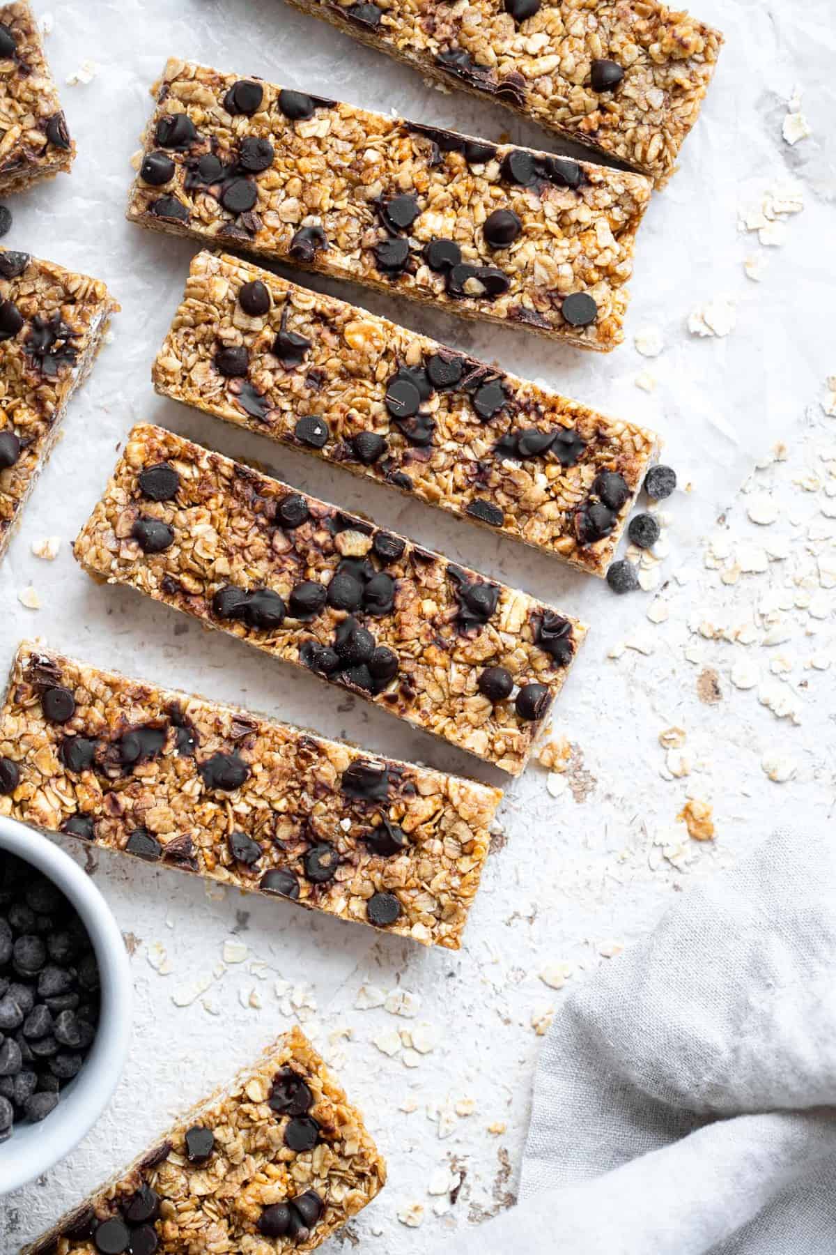 Healthy Chewy Chocolate Chip Granola Bars - This Healthy Chewy Granola Bar Recipe is made with wholesome, simple, pantry essential ingredients! Loaded with chocolate chips and great for kids or adults! | #Foodfaithfitness | #kidfriendly #healthy #snack #eggfree #backtoschool close up overhead shot of healthy homemade granola bars
