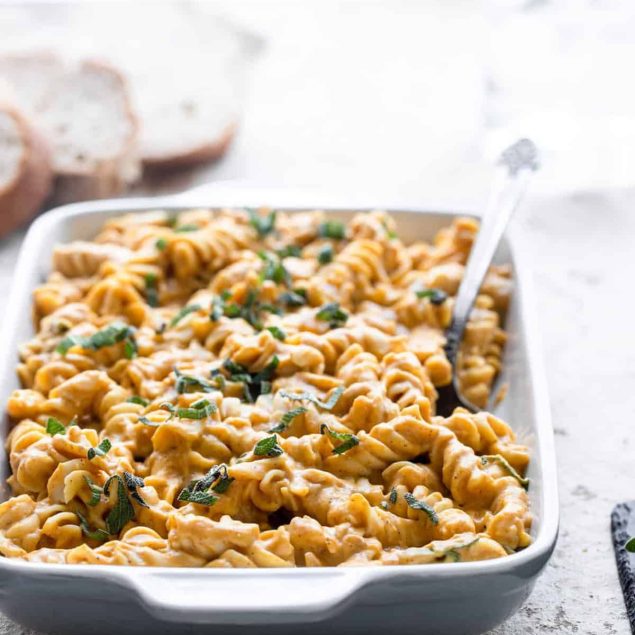 pumpkin pasta in a serving bowl on a table