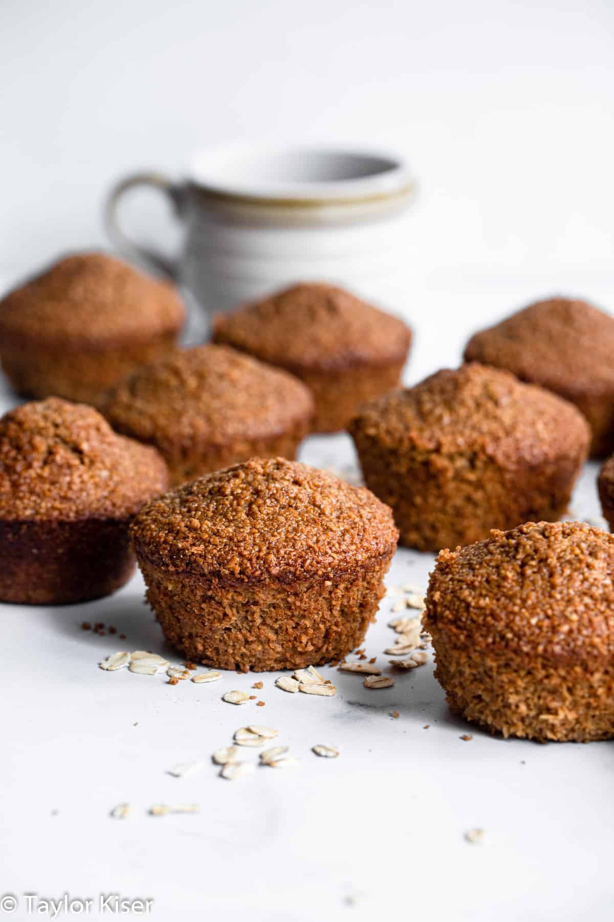 Healthy Oat Bran Muffins - These gluten free muffins are easy, fluffy and great for freezing! A healthy, gluten free breakfast or snack that is great for busy days! | #Foodfaithfitness | #glutenfree #healthy #dairyfree #muffins healthy oat bran muffins sitting on a table with coffee