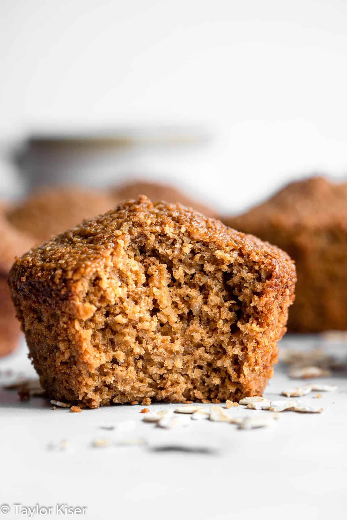Healthy Oat Bran Muffins - These gluten free muffins are easy, fluffy and great for freezing! A healthy, gluten free breakfast or snack that is great for busy days! | #Foodfaithfitness | #glutenfree #healthy #dairyfree #muffins healthy oat bran muffins with a bite taken out of one