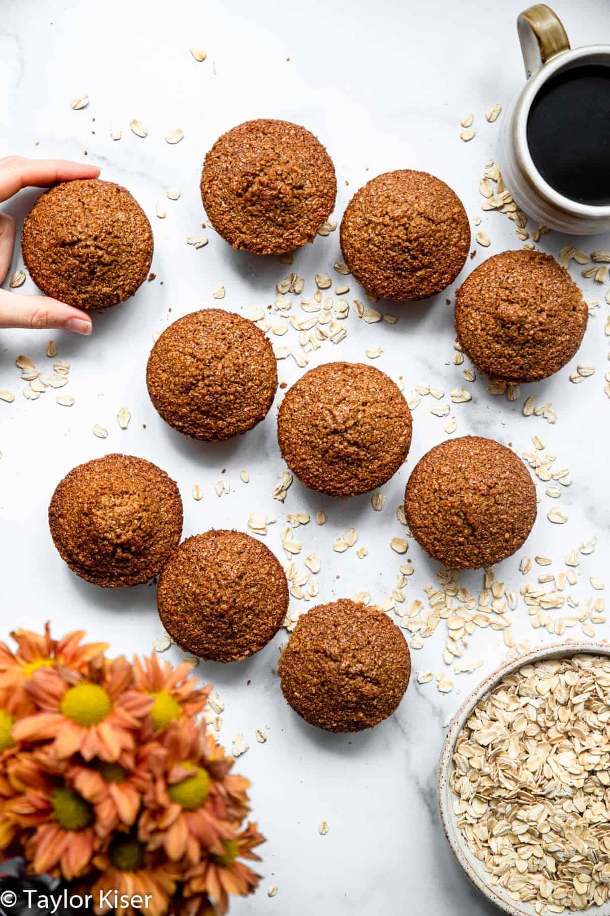 Healthy Oat Bran Muffins - These gluten free muffins are easy, fluffy and great for freezing! A healthy, gluten free breakfast or snack that is great for busy days! | #Foodfaithfitness | #glutenfree #healthy #dairyfree #muffins overhead of gluten free oat bran muffins on a table