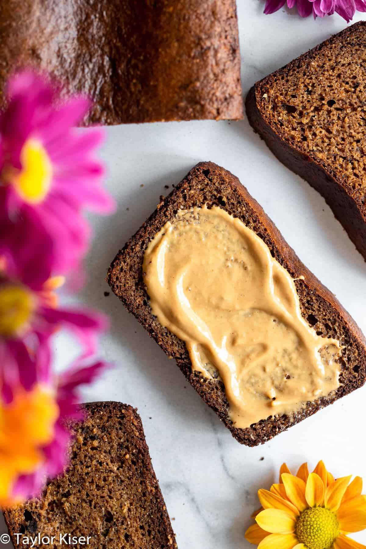 High Protein Banana Bread - This easy banana bread is naturally gluten free and packed with protein! Moist, tender, easy to make and so delicious! The best snack or breakfast! | #Foodfaithfitness | #Glutenfree #healthy #proteinpowder #paleo #grainfree High protein banana bread with cashew butter on it
